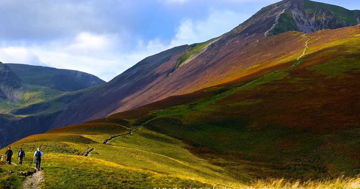 Green hills under a blue sky