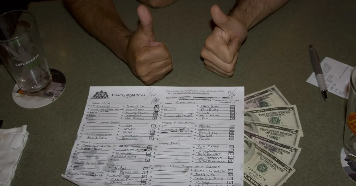 A quiz answer sheet on a pub table