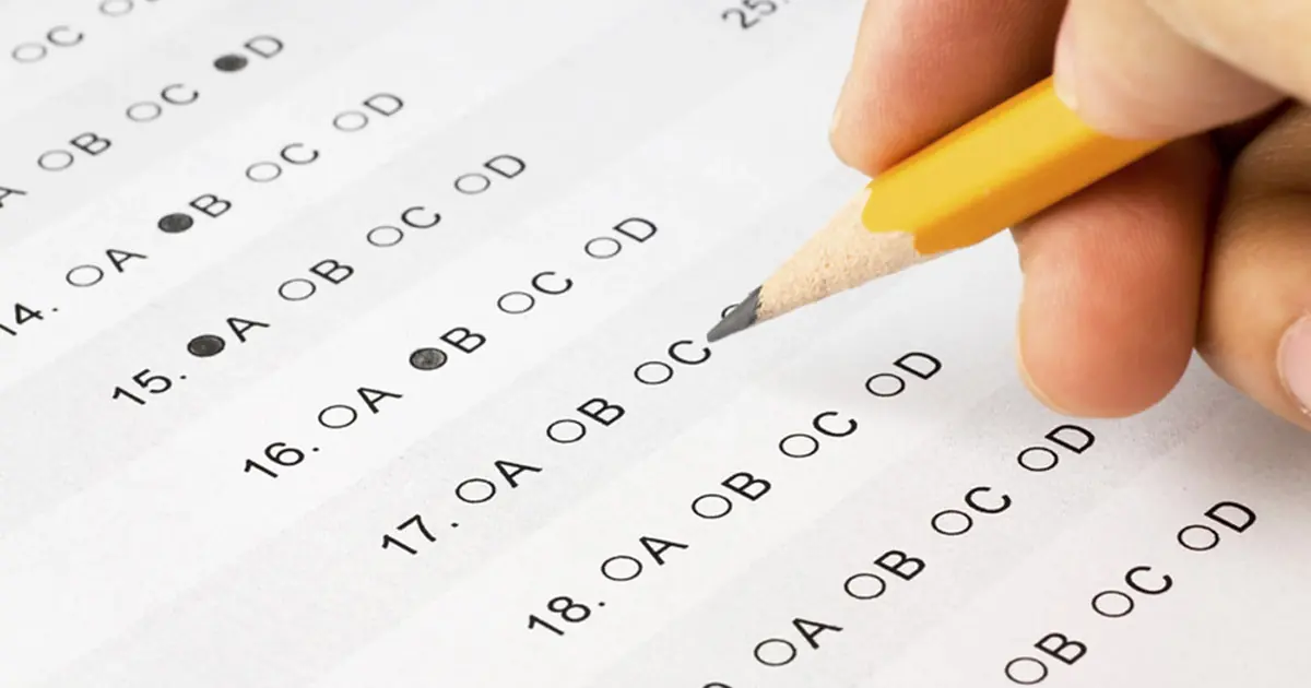 A pencil filling in a multiple-choice answer sheet